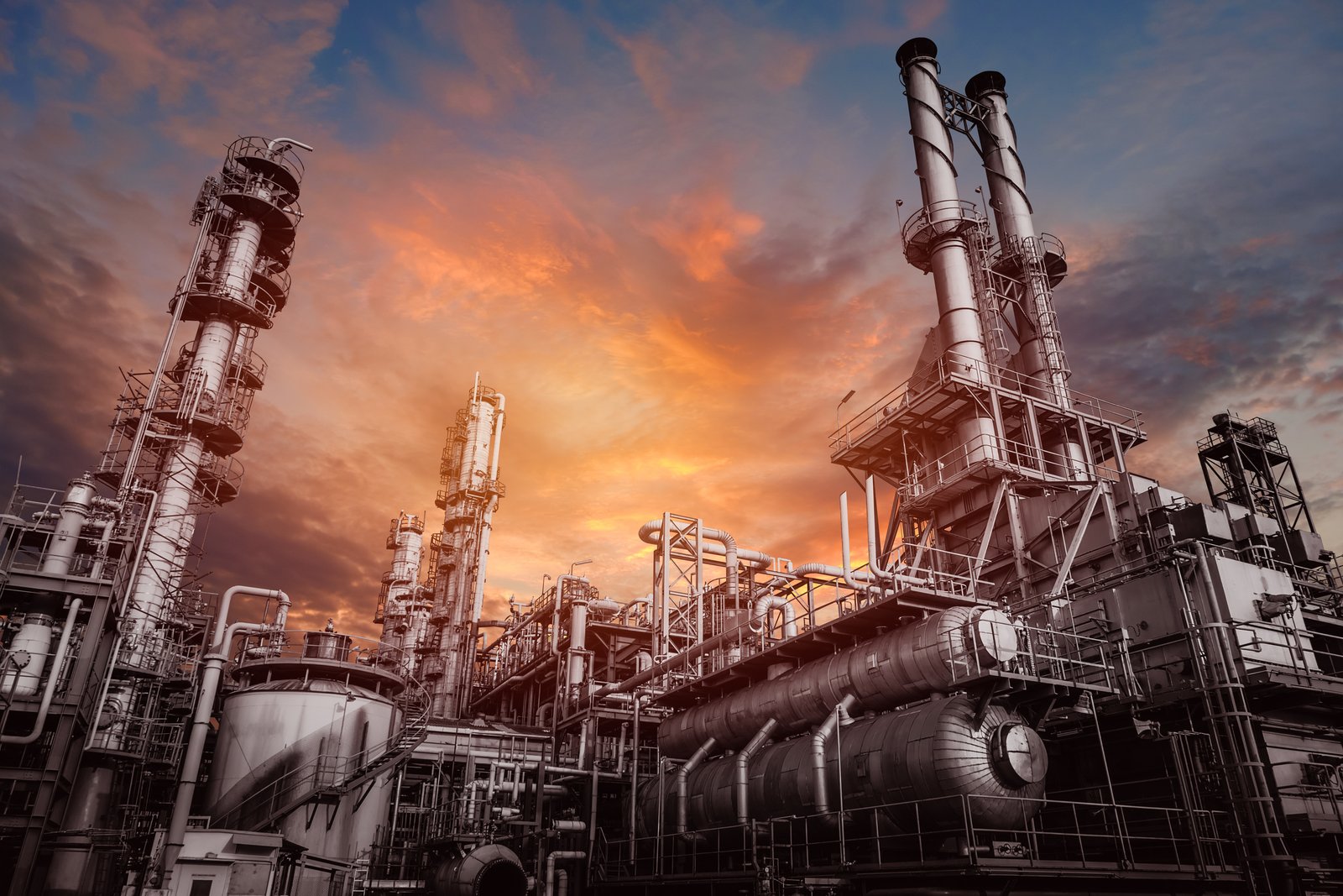 Industrial refinery and steel infrastructure at sunset