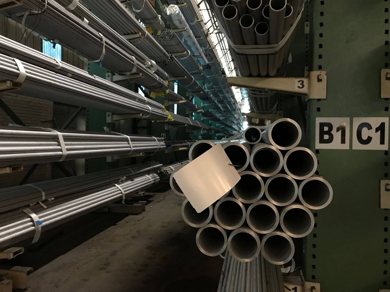 Round square and hex steel bars in organized storage